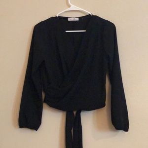 Black long sleeve blouse with triangle open back